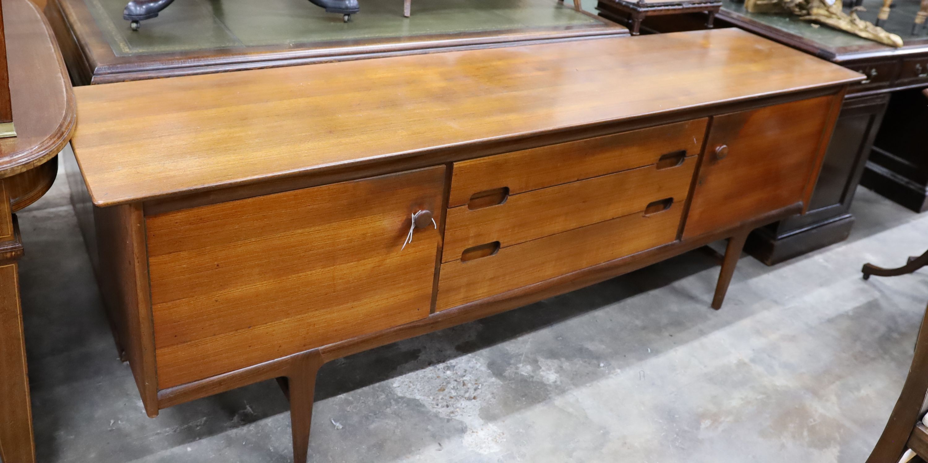 A mid century design teak sideboard, length 209cm, depth 49cm, height 75cm